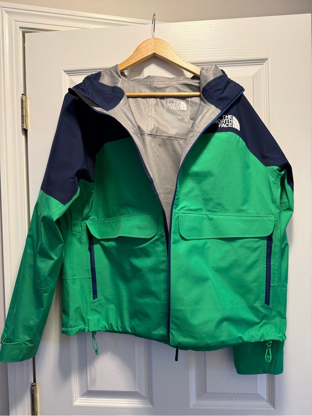 The North Face Green Jacket with Navy Shoulders and Hood